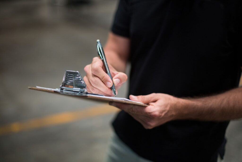 person filling out paperwork